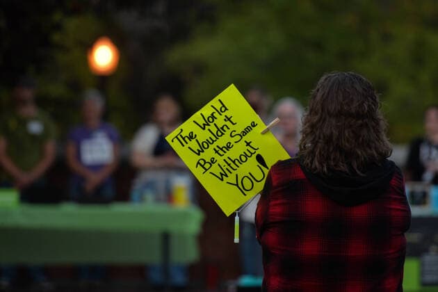 Bridge Of Life Candlelight Vigile In Edmonton Participant holds a placard with words The World Wouldn t Be the Same Without You! . Edmontonians participating in the sixth annual Bridge Of Life Suicide Awareness Prevention candlelight vigil organised by YEG Mental Health, a group dedicated to raising awareness about mental health issues in the greater Edmonton area. On Friday, September 10, 2021, in Edmonton, Alberta, Canada. Edmonton Canada widak-bridgeof210910_npj17  Copyright: xArturxWidakx