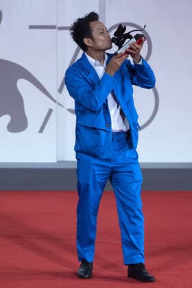September 12, 2021, Venice, Italy: Director Neang Kavich receives the Best Actor Orizzonti Award on behalf of Piseth Chhun for White Building during the Winners Red Carpet as part of the 78th Venice International Film Festival in Venice, Italy on September 11, 2021. Paolo Cotello imageSPACE Venice Italy - ZUMAs181 20210912_zea_s181_053 Copyright: xImagespacex