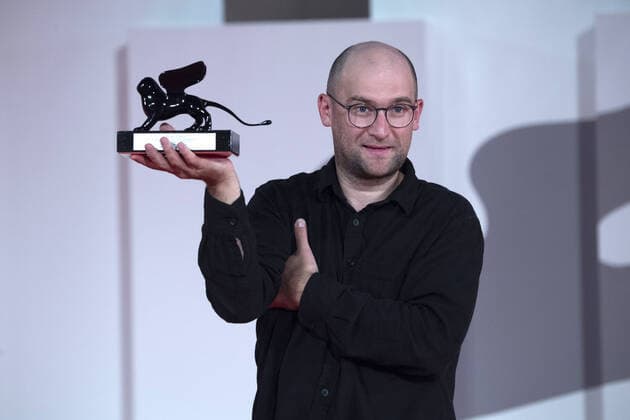 September 12, 2021, Venice, Italy: Director Laurynas Bareisa poses with the Orizzonti Award for Best Film for Piligrimai (Pilgrims) during the Winners Red Carpet as part of the 78th Venice International Film Festival in Venice, Italy on September 11, 2021. Paolo Cotello imageSPACE Venice Italy - ZUMAs181 20210912_zea_s181_042 Copyright: xImagespacex