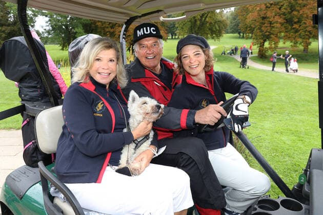 Tabaluga Golf Cup 2021 by Michael Roll For the 27th time Michael Roll organized the Tabaluga Golf Cup for the benefit of his Tabaluga Foundation in the picture Marianne and Michael Hartl together with Anjorka Strechel and the dog Winnie in the golf cart, Tutzing Bavaria Germany Golfclub Tutzing
