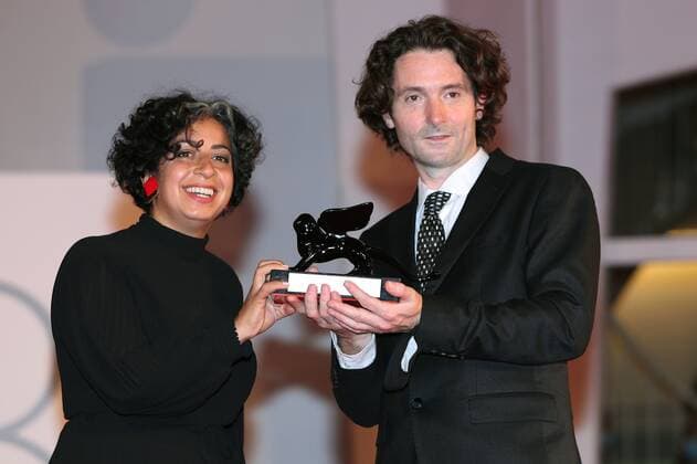Italy Venice Film Festival 6649385 11.09.2021 Directors May Abdalla and Barry Gene Murphy pose with the Grand Jury Prize for Best VR for Goliath: Playing With Reality at the awards winner photocell during the 78th Venice International Film Festival, in Venice, Italy. Ekaterina Chesnokova Sputnik Venice Italy  Copyright: xEkaterinaxChesnokovax
