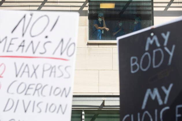 September 13, 2021, Toronto, ON, Canada: Healthcare workers watch from as window as demonstrators gather outside Toronto General Hospital, on Monday September 13, 2021, to protest against COVID-19 vaccines, COVID-19 vaccine passports and COVID-19 related restrictions. Toronto Canada  - ZUMAc35_ 20210913_zaf_c35_020 Copyright: xChrisxYoungx