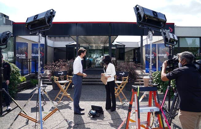 September 13, 2021, Burnaby, B.C, Canada: Liberal leader Justin Trudeau prepares to take part in an interview with Global reporter Neetu Garcha in Burnaby, B.C., on Monday, Sept. 13, 2021. The interview was set to take part outside but had to be moved inside due to the a lone protester heckling Trudeau. Burnaby Canada  - ZUMAc35_ 20210913_zaf_c35_072 Copyright: xSeanxKilpatrickx