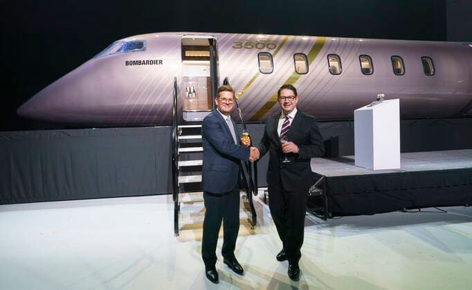 September 14, 2021, Montreal, PQ, Canada: Bombardier president and CEO Eric Martel, right, and chairman of the board Pierre Beaudoin shake hands in front of a scale model of the new Challenger 3500 in Montreal on Tuesday, September 14, 2021. Montreal Canada  - ZUMAc35_ 20210914_zaf_c35_005 Copyright: xPaulxChiassonx