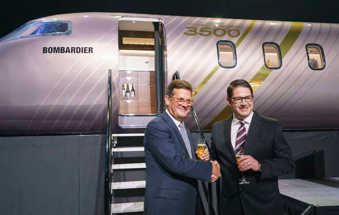 September 14, 2021, Montreal, PQ, Canada: Bombardier president and CEO Eric Martel, right, and chairman of the board Pierre Beaudoin shake hands in front of a scale model of the new Challenger 3500 in Montreal on Tuesday, September 14, 2021. Montreal Canada  - ZUMAc35_ 20210914_zaf_c35_006 Copyright: xPaulxChiassonx