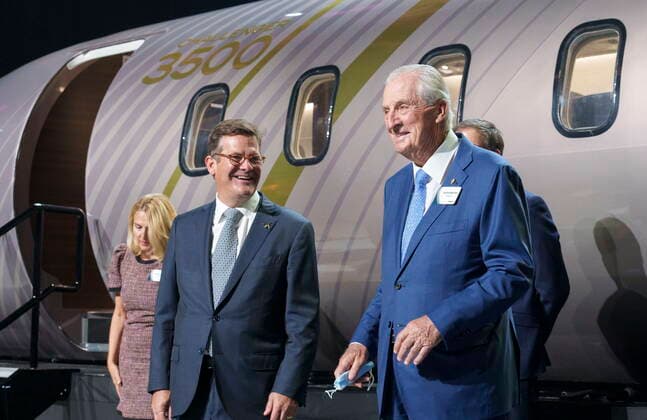 September 14, 2021, Montreal, PQ, Canada: Bombardier chairman of the board Pierre Beaudoin, chats with his father and former CEO Laurent Beaudoin in front of a scale model of the new Challenger 3500 in Montreal on Tuesday, September 14, 2021. Montreal Canada  - ZUMAc35_ 20210914_zaf_c35_008 Copyright: xPaulxChiassonx