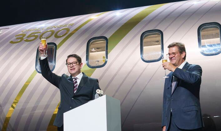 September 14, 2021, Montreal, PQ, Canada: Bombardier president and CEO Eric Martel, left, and chairman of the board Pierre Beaudoin toast in front of a scale model of the new Challenger 3500 in Montreal on Tuesday, September 14, 2021. Montreal Canada  - ZUMAc35_ 20210914_zaf_c35_009 Copyright: xPaulxChiassonx