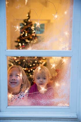 Sisters looking out of window with Christmas decorations, 22.12.2014, Copyright: xRUSSxROHDEx, model released, looking through window,blond hair,differential focus,head and shoulders,anticipation,at home,childhood,bonding,festive,quality time,togetherness,excitement,happiness,christmas decoration,christmas light,christmas tree,frosted glass,child,toddler,female,girl,baby girl,two people,indoors,celebrations,christmas,family,sister,leisure,1 to 2 years,net,6 to 7 years,enjoyment,stars,only female,holiday season,January 2015 Release,Looking Through Window,Child,Elementary Age,6-7 Years,Toddler,1-2 Years,Female,Girls,Girl,Baby Girl,Family,Sister,Anticipation,Celebration,Childhood,Enjoyment,Festivity,Excitement,Freetime,Quality Time,Relation Ref:IS09AN41W