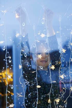 View through window of girl arms raised hanging decorative lights, looking at camera smiling, 26.02.2016, Copyright: xJudithxHaeuslerx, model released, decorating,hanging,looking at camera,looking through an object,at home,childhood,preparation,creativity,cute,festive,innocence,happiness,decoration,child,caucasian ethnicity,female,girl,one person,window,indoors,day,christmas,traditional holiday,arms raised,smiling,6 to 7 years,decorative light,March 2016 Release,Decorating,Gesturing,Arms Raised,Hanging,Looking Through An Object,Caucasian Ethnicity,Child,Elementary Age,6-7 Years,Female,Girls,Girl,Childhood,Creativity,Cute,Enjoyment,Festivity,Innocence,Preparation,Wellbeing,Happiness,One Person,Smiling,Christmas,Looking At Camera,Decoratio Ref:IS09AW2BL