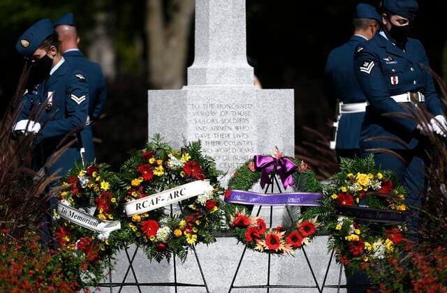 September 19, 2021, Ottawa, ON, CAN: Sentries stand among wreaths laid at a ceremony marking the 81st anniversary of the Battle of Britain at Beechwood National Military Cemetery, in Ottawa, on Sunday, Sept. 19, 2021. Ottawa CAN  - ZUMAc35_ 20210919_zaf_c35_012 Copyright: xJustinxTangx