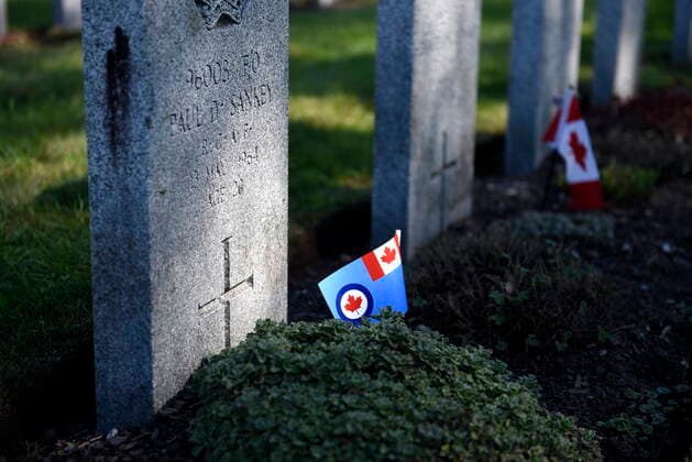 September 19, 2021, Ottawa, ON, CAN: A RCAF flag is seen at the foot of the grave of a veteran who served during the era of the Battle of Britain, during a ceremony marking its 81st anniversary at Beechwood National Military Cemetery, in Ottawa, on Sunday, Sept. 19, 2021. Ottawa CAN  - ZUMAc35_ 20210919_zaf_c35_013 Copyright: xJustinxTangx