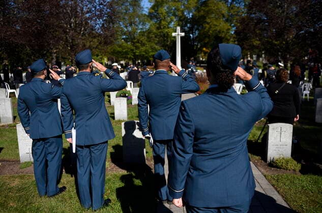 September 19, 2021, Ottawa, ON, CAN: Canadian Forces Members salute during the playing of the Last Post during a ceremony marking the 81st anniversary of the Battle of Britain at Beechwood National Military Cemetery, in Ottawa, on Sunday, Sept. 19, 2021. Ottawa CAN  - ZUMAc35_ 20210919_zaf_c35_021 Copyright: xJustinxTangx