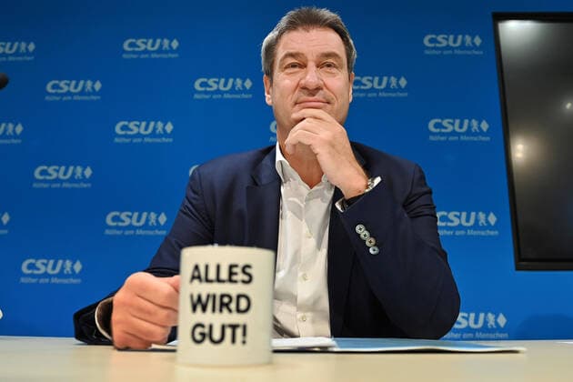 Markus SOEDER State Premier of Bavaria and CSU chairman behind a cup with the inscription ALL WILL BE WELL Constituent meeting of the CSU executive board at the CSU headquarters in Munich on 20 09 2021