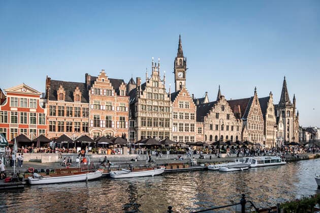 Tourist boat on the river Leie, Ganslei quay, Vrije Schippers town hall, medieval houses, Ghent, Flanders, Belgium, Europ