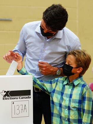 September 20, 2021, Montreal, PQ, Canada: Liberal leader Justin Trudeau casts his ballot in the 44th general federal election as he s joined by his son Hadrien in his riding of Papineau, Montreal on Monday, Sept. 20, 2021. Montreal Canada  - ZUMAc35_ 20210920_zaf_c35_030 Copyright: xSeanxKilpatrickx