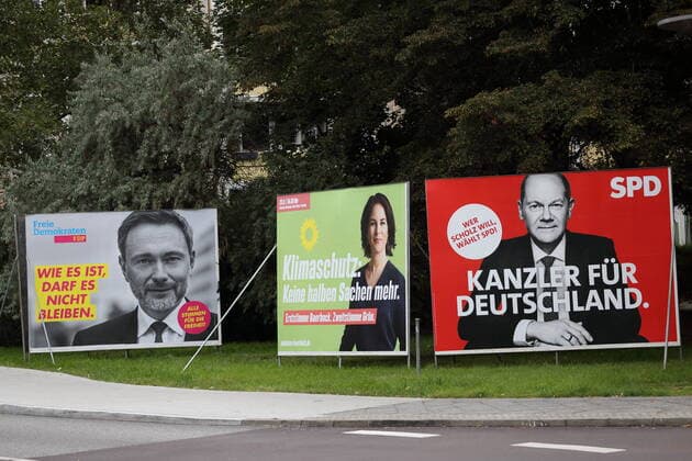 Christian Lindner FDP , candidate for chancellor Annalena Baerbock Bündnis 90 Die Grünen and candidate for chancellor Olaf Scholz SPD on three election posters for the Bundestag election on a street in Potsdam, 21 September 2021 The election takes place on 26 September Bundestag election 2021