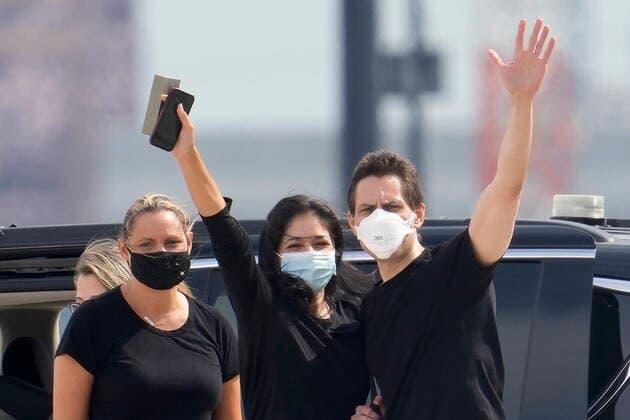 September 25, 2021, Toronto, on, Canada: Michael Kovrig, centre right, waves to media as his wife Vina Nadjibulla, centre left, and sister Ariana Botha, left, after his arrival at Pearson International Airport in Toronto, Saturday, Sept. 25, 2021. Two Canadians who were imprisoned in China for nearly three years are home. Toronto Canada - ZUMAc35_ 20210925_zaf_c35_007 Copyright: xFrankxGunnx