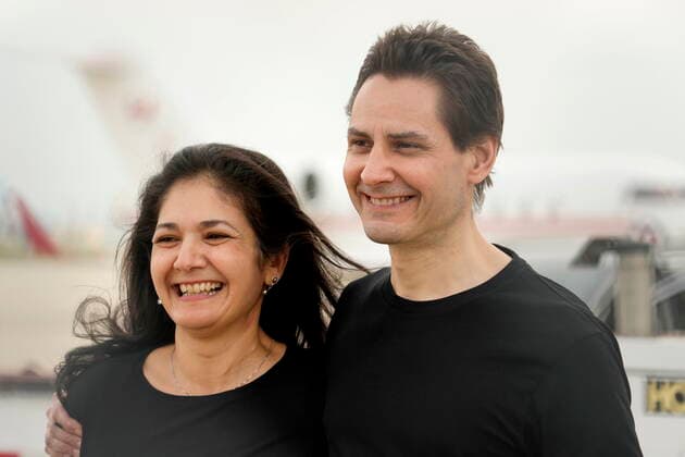 September 25, 2021, Toronto, on, Canada: Michael Kovrig embraces his wife Vina Nadjibulla, left, after arriving at Pearson International Airport in Toronto, Saturday, Sept. 25, 2021. Two Canadians who were imprisoned in China for nearly three years are home. Toronto Canada  - ZUMAc35_ 20210925_zaf_c35_011 Copyright: xFrankxGunnx