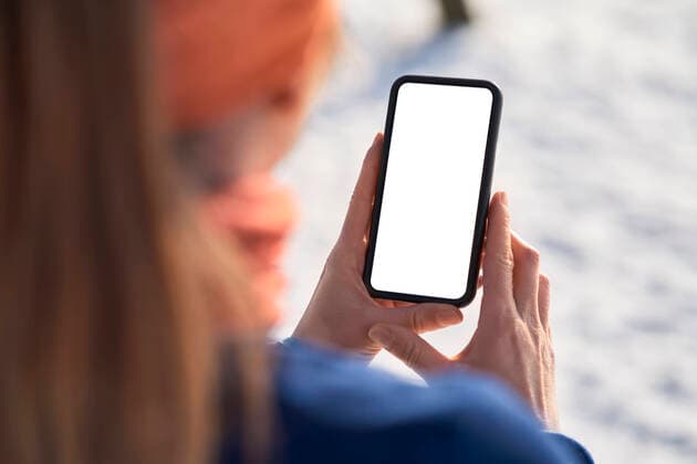 Woman holding smart phone model released Symbolfoto BSZF01910