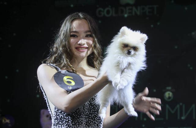 MOSCOW, RUSSIA â€“ SEPTEMBER 28, 2021: A dog named Luna with its owner, blogger Nina Ilina at a ceremony to present the 2021 Golden Pet Awards at the Federation Tower of the Moscow International Business Centre. Vladimir Gerdo TASS  TS112599