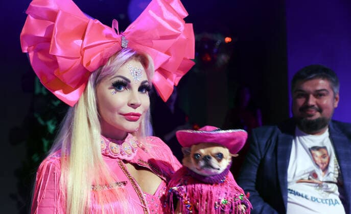 MOSCOW, RUSSIA â€“ SEPTEMBER 28, 2021: Blogger Tanya Tuzova with a dog at a ceremony to present the 2021 Golden Pet Awards at the Federation Tower of the Moscow International Business Centre. Vladimir Gerdo TASS  TS1125A6