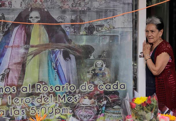 Followers Of Santa Muerte Call For An End To The Pandemic In Mexico Enriqueta Romero, guardian of the Santa Muerte temple, waits for her followers outside her temple located in Tepito, Mexico City, where several people gathered to give thanks for the favours granted by La Nina Blanca during the COVID-19 health emergency in Mexico and the yellow epidemiological traffic light in the capital. Mexico City Mexico vieyra-notitle211001_npYKP  Copyright: xGerardoxVieyrax