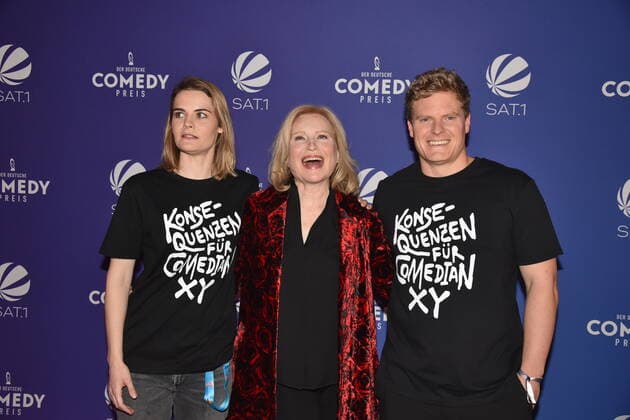 Comedian Hazel Brugger l and her husband Thomas Spitzer r and Maren Kroymann m arrive at the German Comedy Award 2021 ceremony.