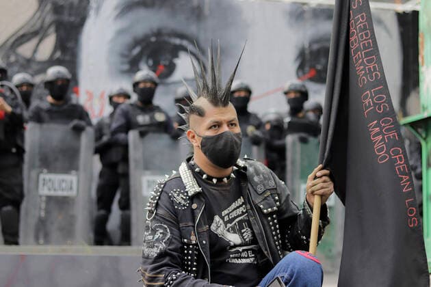 53rd Anniversary Of The Massacre Of Tlatelolco, Mexico A member of the Black Bloc sits on Eje Central in Mexico City, as various organisations march to the Zocalo of the capital to mark the 53rd anniversary of the Tlatelolco Massacre that took place on 2 October 1968 in the square. Mexico City Mexico vieyra-notitle211002_npkXo  Copyright: xGerardoxVieyrax