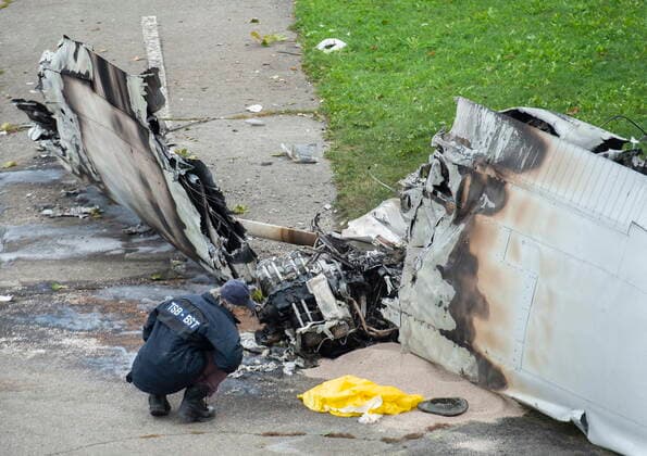 October 3, 2021, Montreal, PQ, Canada: A member of the Transportation Safety Board (TSB) inspects the wreckage of a plane at a crash site in Montreal, Sunday, Oct. 3, 2021. The small plane crashed on Ile Sainte-Helene near MontrealÃ¢â‚¬â ¢s Old Port on Saturday. Montreal Canada  - ZUMAc35_ 20211003_zaf_c35_002 Copyright: xGrahamxHughesx