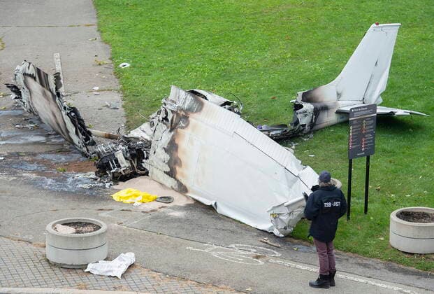 October 3, 2021, Montreal, PQ, Canada: A member of the Transportation Safety Board (TSB) inspects the wreckage of a plane at a crash site in Montreal, Sunday, Oct. 3, 2021. The small plane crashed on Ile Sainte-Helene near MontrealÃ¢â‚¬â ¢s Old Port on Saturday. Montreal Canada  - ZUMAc35_ 20211003_zaf_c35_005 Copyright: xGrahamxHughesx