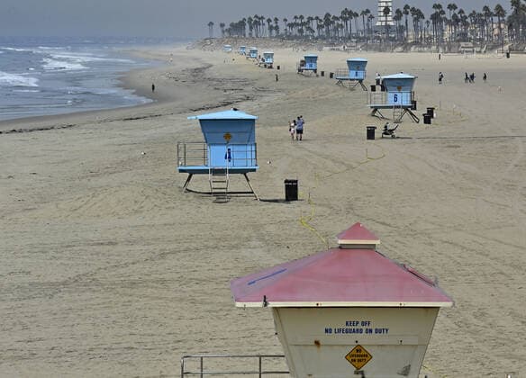 The deserted beach, off limits to swimmers after a major oil spill dumped 126,000-gallon oil from an offshore oil platform is seen in Huntington Beach, California on October 4, 2021. The massive oil spill from an offshore rig was causing major ecological damage in the waters off Huntington Beach today, as officials closed the area to the public and said beaches in the city could be shut down for several weeks or even months.  LAP2021100417 JIM