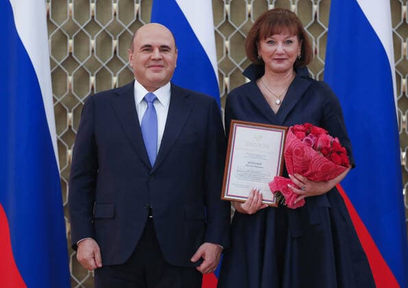 MOSCOW, RUSSIA - OCTOBER 5, 2021: Russia s Prime Minister Mikhail Mishustin (L) poses with South Ural State Humanitarian Pedagogical University department chair Natalya Korneyeva during a ceremony to award commendations and state prizes in the field of education and mark Teachers Day. Dmitry Astakhov POOL TASS  TS11321E
