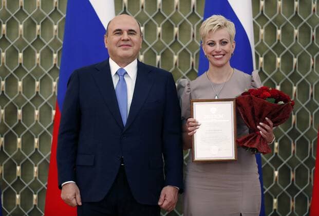Russia Mishustin Education Award 6666203 05.10.2021 Russian Prime Minister Mikhail Mishustin and Viktoria Kozhevnikova, senior lab researcher at the Art Studies and Culturology Institute of the Russian Academy of Education, attend a ceremony to award commendations and state prizes in the field of education and mark Teachers Day, in Moscow, Russia. Dmitry Astakhov Sputnik Moscow Russia  Copyright: xDmitryxAstakhovx