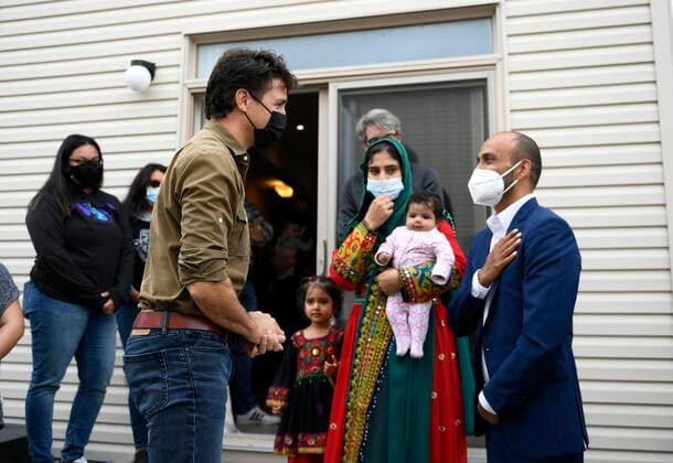 October 9, 2021, Ottawa, on, Canada: Prime Minister Justin Trudeau greets Obaidullah Rahimi, right, his wife Arezoo, and daughters Hawa, 2 months, and Ayat, 3, in Ottawa, on Saturday, Oct. 9, 2021. Obaidullah Rahimi worked at the Canadian Embassy in Afghanistan; his family is one of 22 resettled Afghan families in the Ottawa area. Ottawa Canada - ZUMAc35_ 20211009_zaf_c35_009 Copyright: xJustinxTangx