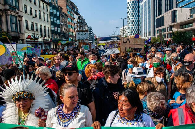 October 10, 2021, Brussels, Belgium: Indigenous people seen during the protest..After a year and a half, Youth for the Climate the school-strike movement inspired by Greta Thunberg and led by Flemish schoolgirl Anuna De Wever is back in action on the streets of Brussels to protest for better climate policy. Around 50.000 people gathered at the Brussels North station to protest against the lack of action on the climate crisis. From there, the demonstration walked in front of the European Union building, and ended at the Parc Cinquantenarie. Brussels Belgium - ZUMAs197 20211010_zaa_s197_206 Copyright: xAnaxFernandezx