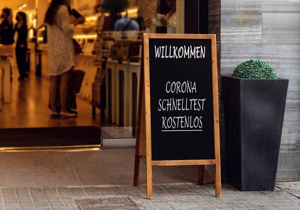 11 October 2021: Free Corona quick test, citizen test free of charge on a sign in front of a store, Free Covid 19 test are offered