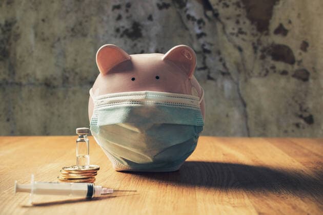05 September 2021: coronavirus covid-19 vaccination cost concept, piggy bank wearing medical protection mask with gold coins and a syringe vaccine, health insurance concept