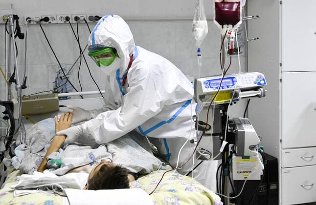 KRASNODAR, RUSSIA - OCTOBER 12, 2021: A medical worker treats a child at a COVID-19 facility of Krasnodar s Children s Infectious Diseases Hospital. Roman Sokolov TASS  TS114110