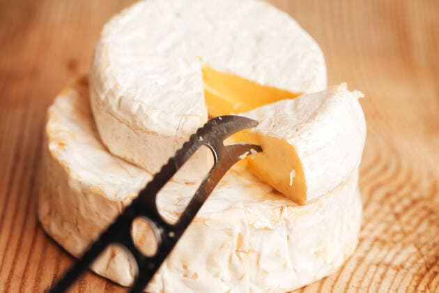 a piece of Brie cheese Copyright: xx 7400354