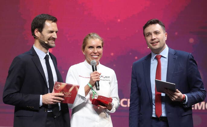 MOSCOW, RUSSIA - OCTOBER 14, 2021: Michelin Guides International Director Gwendal Poullennec, Biologie chef Yekaterina Alyokhina, and journalist Sergei Krasnov (L-R) attend a ceremony held at the Zaryadye Concert Hall to award Michelin stars to Moscow restaurants and chefs as well as to introduce the first Michelin Guide to Moscow. Vyacheslav Prokofyev TASS  TS1143EB