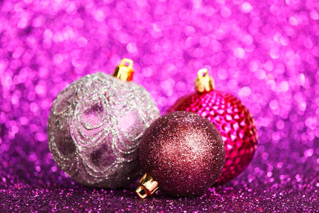Christmas card with beautiful shiny decoration over purple background Copyright: xx 10054540