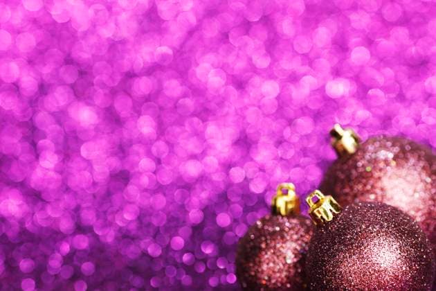 Christmas card with beautiful shiny decoration over purple background Copyright: xx 10194954
