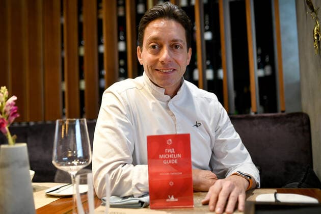 MOSCOW, RUSSIA - OCTOBER 16, 2021: Chef David Hemmerle poses with the trophy at the Grand Cru restaurant awarded a Michelin star. Maxim Grigoryev TASS  TS114603