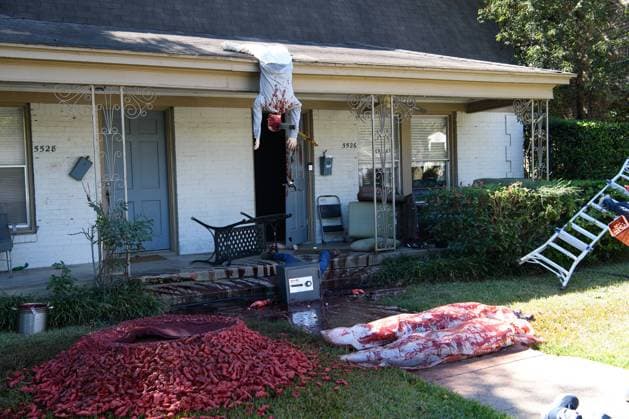 October 16, 2021, Dallas, Texas: An extremely realistic Halloween decoration in East Dallas - with a lawn full of gruesomely murdered mannequins Ã¢â‚¬ attracts not just neighbors but multiple visits from the Dallas police, called by neighbors who believed they d stumbled onto a real crime scene...Artist STEVEN NOVAK improved upon his 2020 presentation by adding a wood chipper blood fountain as the centerpiece - a stream of fake blood sprays out of a commercial fountain head at 3,000 gallons per hour, into a kiddie pool full of shredded mannequin parts...He added a fake door to his house, complete with an embedded axe handle and bloody handprints. He will be adding LED lights this week, in anticipation of more evening drive-by visitors lo - ZUMAa183 20211016_znp_a183_008 Copyright: xAvixAdelmanx