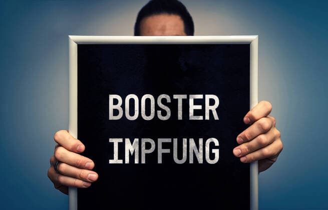 October 19, 2021: booster vaccination, sign that says booster vaccination, Covid-19 corona virus vaccine protection by a third dose of vaccine, third vaccination is called booster vaccination