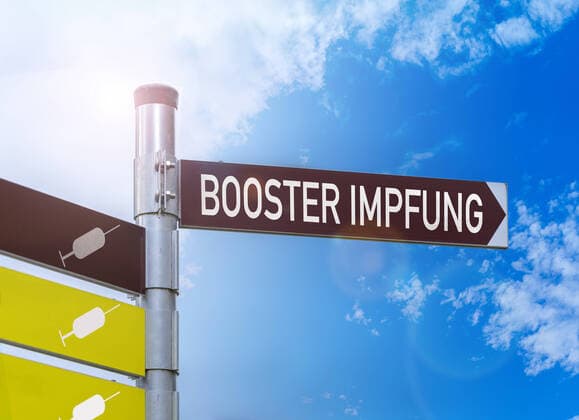 October 19, 2021: booster vaccination, sign that says booster vaccination, Covid-19 corona virus vaccine protection by a third dose of vaccine, third vaccination is called booster vaccination