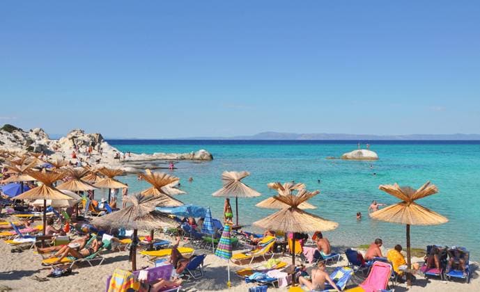 GREECE - MAY 19: Beautiful beach on May 19, 2011 on the Portokali Beach also called Orange Beach, near Sarti, on the east coast of Sithonia Greece GREECE - MAY 19: Beautiful beach on May 19, 2011 on the Portokali Beach also called Orange Beach, near Sarti, on the east coast of Sithonia Greece Copyright: xx 39083534