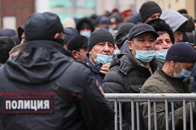 MOSCOW, RUSSIA - OCTOBER 24, 2021: People queue outside Polling Station No 30 at the Uzbek Embassy in Moscow to vote in the 2021 Uzbek presidential election. Uzbek citizen can cast their votes at polling stations in seven Russian cities. Sergei Savostyanov TASS  TS1157C0