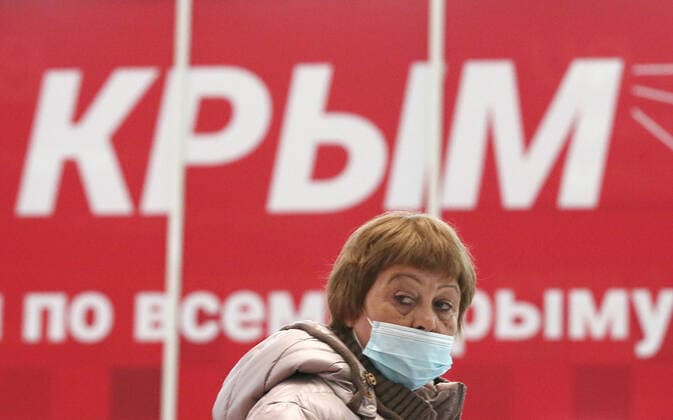 CRIMEA, RUSSIA - OCTOBER 24, 2021: A woman walks past at Simferopol International Airport. Non-working days have been declared in Crimea from October 30 to November 7, the respective presidential decree coming as a response to the rising number of COVID-19 cases in Russia. The Crimean authorities plan to enhance enforcement of public health safety measures at local holiday resorts within this period. Russia s Deputy Prime Minister Tatyana Golikova called on citizens to refrain from travelling between regions so as not to further complicate the existing coronavirus situation. Sergei Malgavko TASS  TS115809