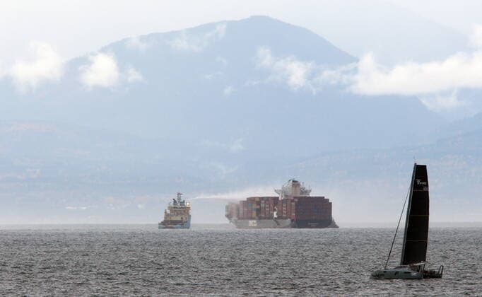 October 24, 2021, Victoria, BC, Canada: Ships work to control a fire onboard the MV Zim Kingston about eight kilometres from the shore in Victoria, B.C., on Sunday, October 24, 2021. The container ship caught fire on Saturday and 16 crew members were evacuated and brought to Ogden Point Pier. Victoria Canada  - ZUMAc35_ 20211024_zaf_c35_005 Copyright: xChadxHipolitox